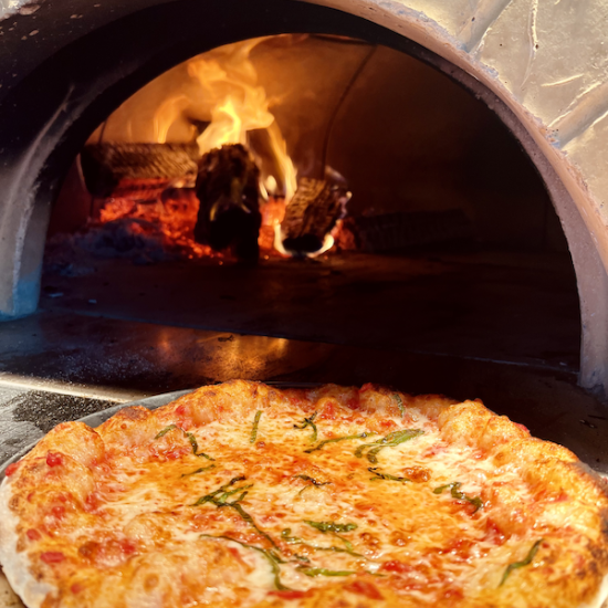 cheeze pizza in front of oven